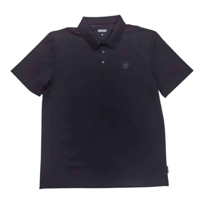 46 15 A rotated | The Jonathan D Golfer Luan in Black is a sophisticated and versatile wardrobe essential, crafted from a premium cotton blend that ensures breathability, softness, and long-lasting comfort. Designed with a structured collar, a refined button placket, and impeccable stitching, this golfer offers a tailored fit that enhances your silhouette while maintaining ease of movement for any occasion. Whether paired with chinos for a polished look or worn casually with jeans, its deep black hue adds timeless elegance, making it the perfect choice for both smart and relaxed settings.