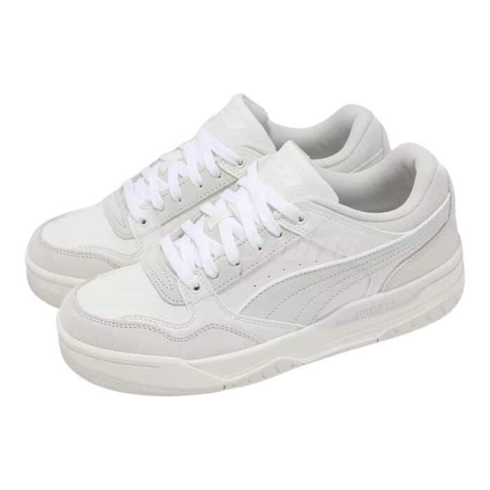 5 198 A | The Puma Rebound Retro SD White / Vapor Grey sneaker combines classic basketball-inspired design with modern comfort, featuring a high-quality leather upper that delivers durability and breathability, while the perforated side panels ensure optimal airflow for all-day wear. With its cushioned EVA foam midsole, this shoe offers superior comfort and support, making it ideal for both casual wear and light physical activities, providing a responsive feel with every step. The rubber outsole enhances grip and traction, ensuring stability on various surfaces, while the iconic Puma branding and retro silhouette add a timeless aesthetic that complements any casual outfit.