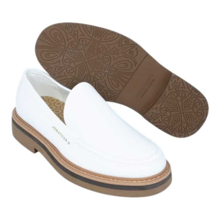 55 117 A | The Jonathan D Slip On Presley in White is a sleek and versatile footwear choice that combines modern minimalism with classic sophistication, making it perfect for both casual and semi-formal occasions. Crafted from high-quality materials, this slip-on shoe features a durable yet comfortable design with a soft upper that molds to the foot, a cushioned insole for all-day support, and a sturdy outsole that ensures excellent traction on various surfaces. Its crisp white color enhances its effortless elegance, while the absence of laces provides a clean, streamlined look that pairs seamlessly with anything from tailored trousers to relaxed denim.