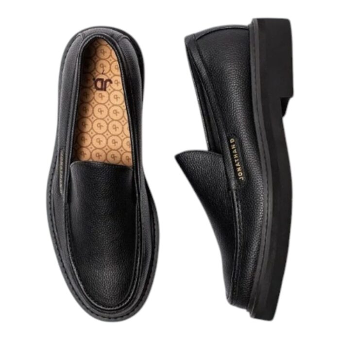 55 118 A | The Jonathan D Slip-On Persley Black is a sophisticated and versatile footwear choice, crafted with premium materials that ensure durability, comfort, and effortless style for any occasion. Designed with a sleek black finish, elastic side gussets for a secure fit, and a cushioned footbed for all-day support, this shoe seamlessly blends practicality with modern elegance, making it ideal for both formal and casual wear. Whether paired with tailored suits for business meetings or relaxed denim for weekend outings, the Persley Black offers a timeless aesthetic that enhances any wardrobe with its refined, minimalist appeal.