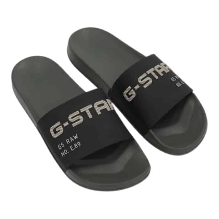 894 7 B | The G-Star Cart V TPU Slides in Black combine minimalist aesthetics with superior comfort, featuring a sleek monochromatic design and a durable TPU construction that ensures long-lasting wear. The ergonomically contoured footbed provides exceptional support and cushioning, making these slides perfect for all-day use, whether you’re relaxing at home or stepping out for casual errands. With a stylish yet understated look, these versatile slides effortlessly complement various outfits while delivering the practicality and durability expected from G-Star’s high-quality craftsmanship.